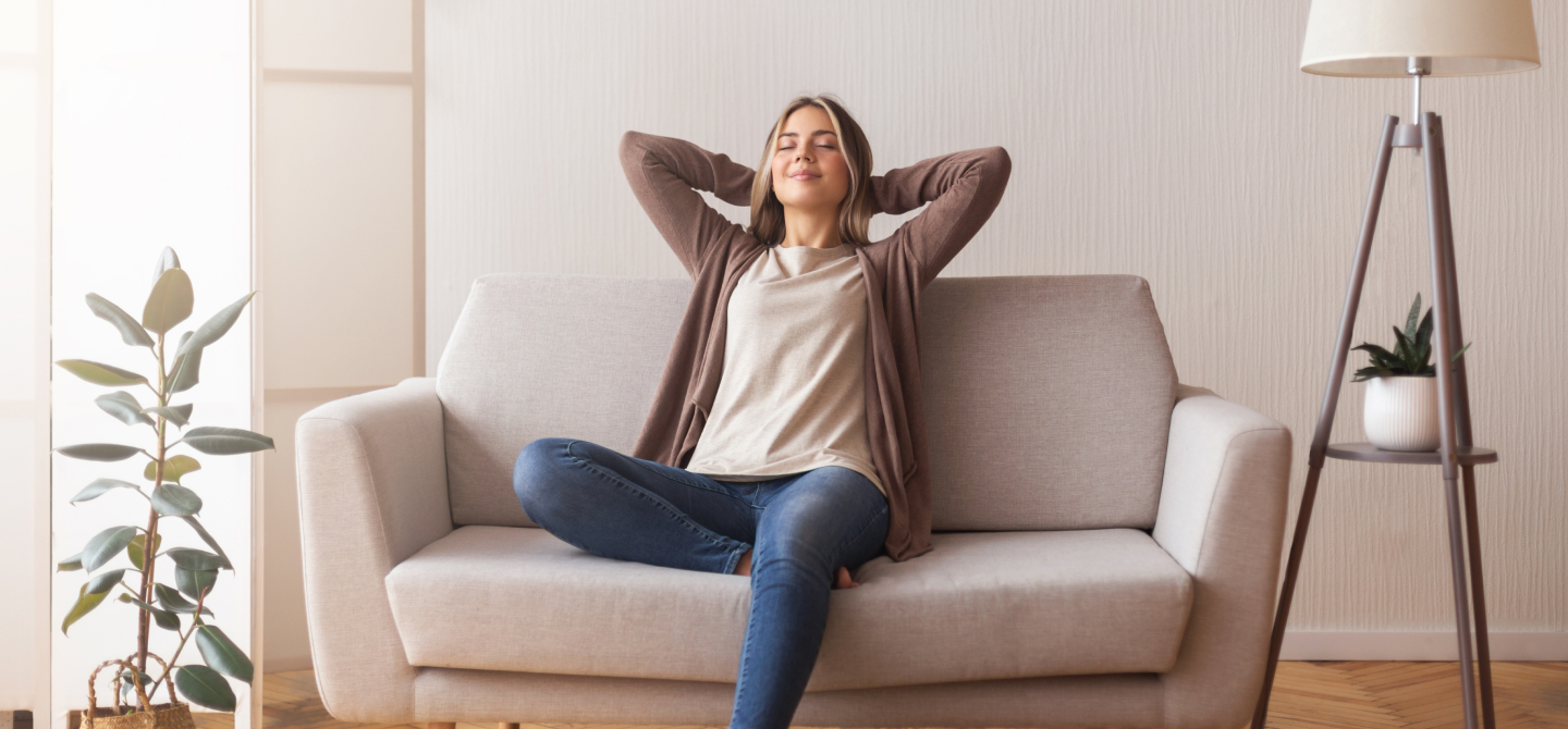 Person relaxing on their sofa